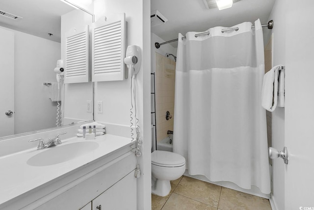 full bathroom with shower / tub combo, vanity, toilet, and tile patterned flooring