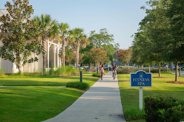 view of property's community with a lawn