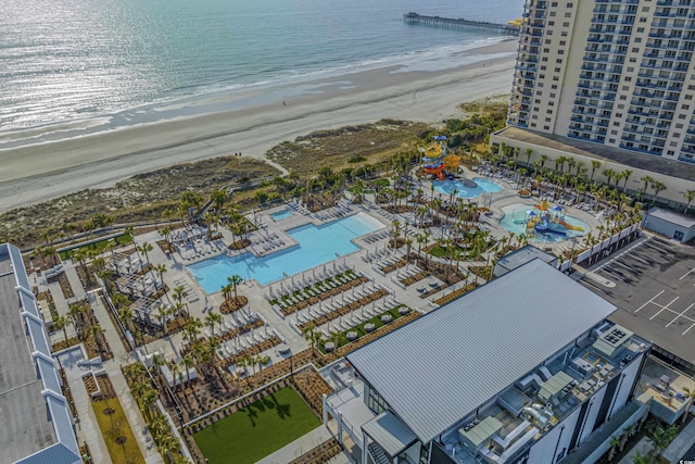 bird's eye view with a water view and a view of the beach