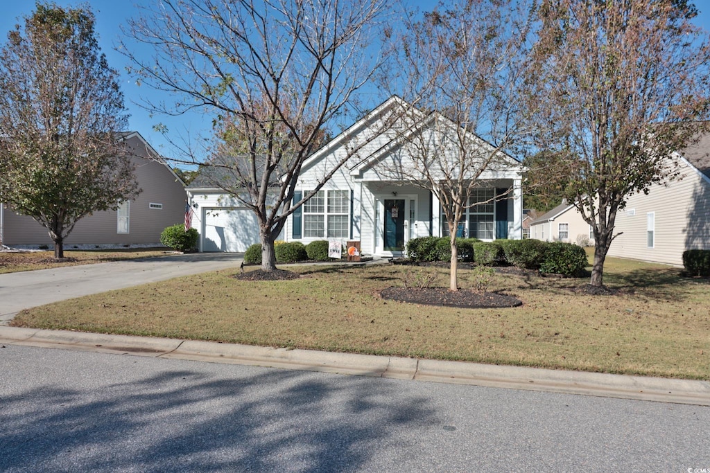 view of front facade featuring a front yard and a garage