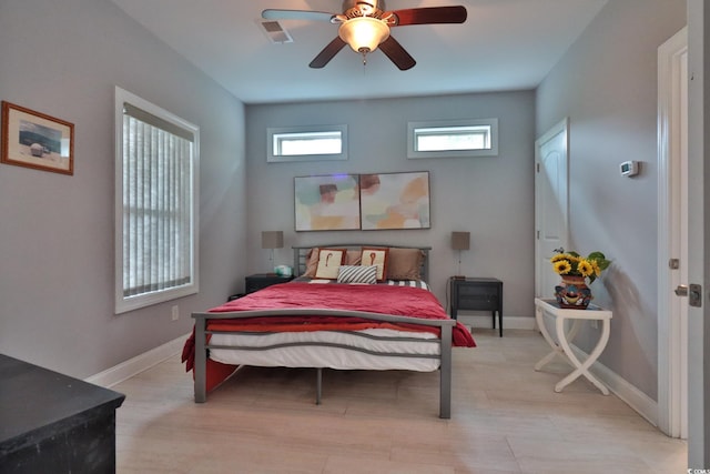 bedroom featuring ceiling fan and light hardwood / wood-style flooring