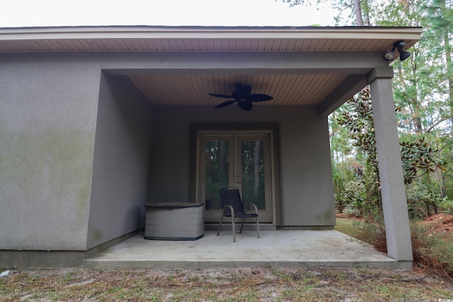 doorway to property with a patio, french doors, and ceiling fan