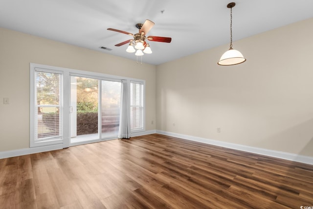 empty room with wood-type flooring and ceiling fan