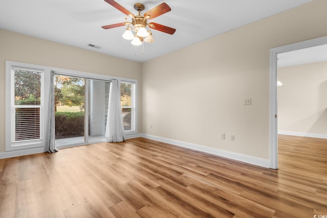 empty room with light wood-type flooring and ceiling fan