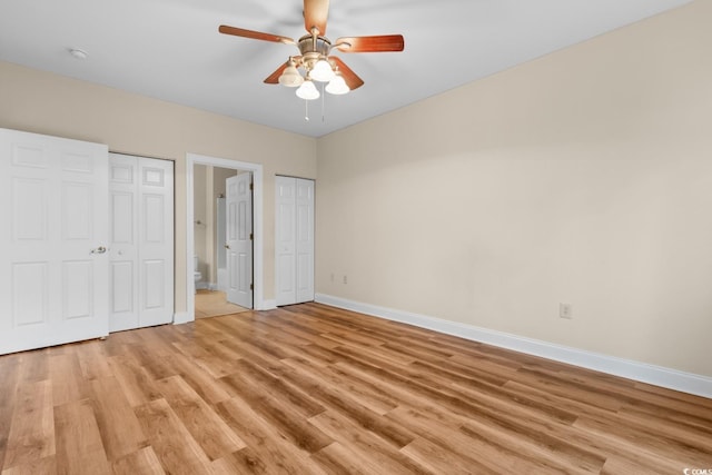 unfurnished bedroom with ceiling fan and light wood-type flooring