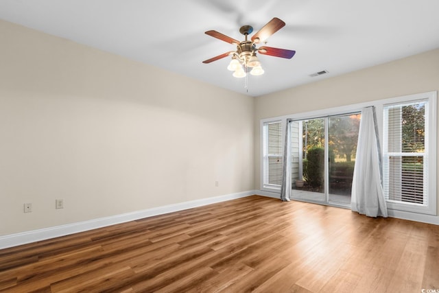 unfurnished room featuring hardwood / wood-style flooring and ceiling fan