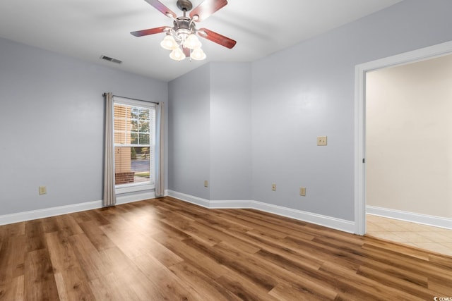 unfurnished room featuring ceiling fan and wood-type flooring