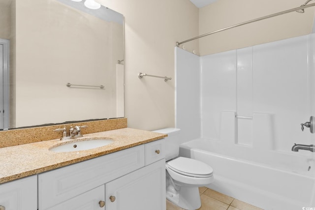 full bathroom featuring toilet, tub / shower combination, vanity, and tile patterned floors