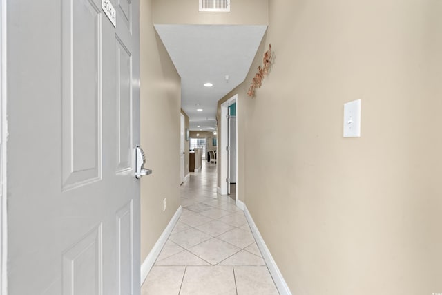 hallway featuring light tile patterned floors