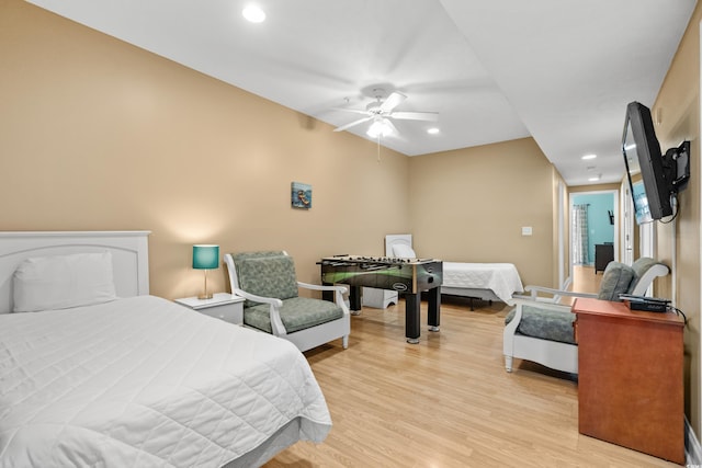 bedroom with light wood-type flooring and ceiling fan