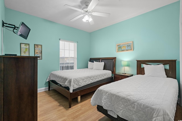 bedroom featuring ceiling fan and light wood-type flooring