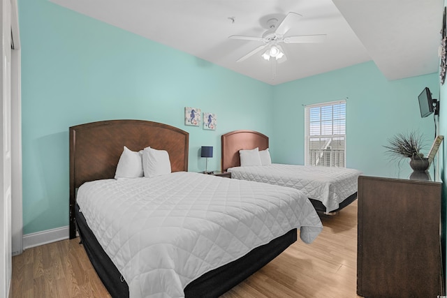 bedroom featuring light wood-type flooring and ceiling fan