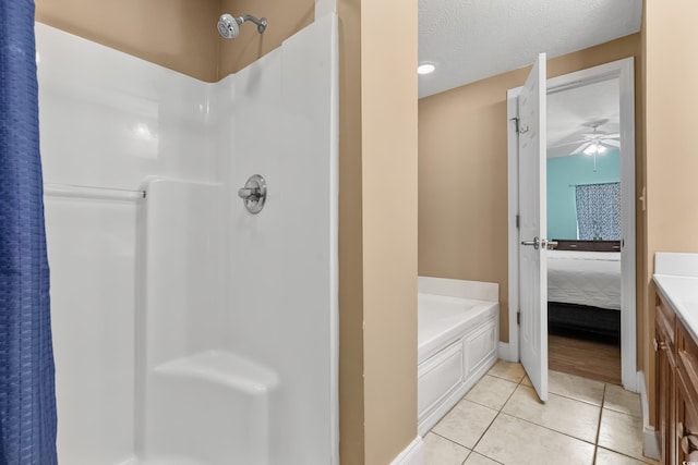 bathroom with separate shower and tub, tile patterned floors, a textured ceiling, vanity, and ceiling fan