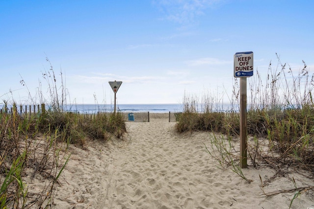 view of community featuring a view of the beach and a water view