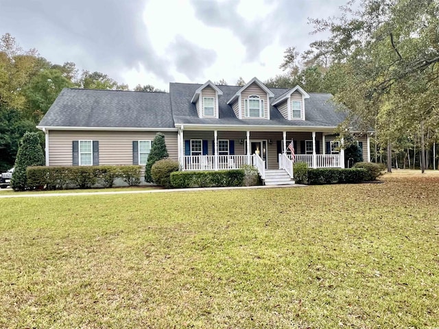 2347 Devine St, Georgetown, SC 29440 - new england style home featuring a porch and a front yard