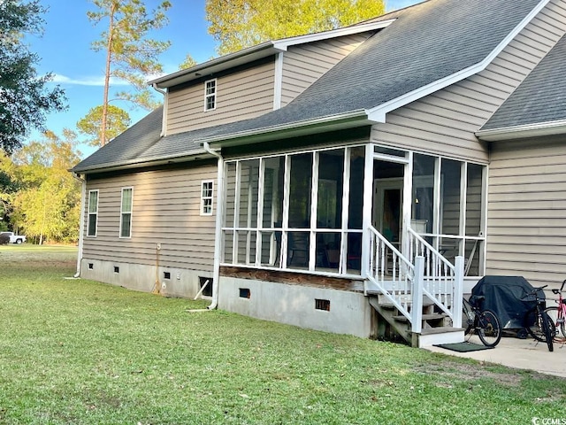 2347 Devine St, Georgetown, SC 29440 - rear view of house with a yard, a shingled roof, a sunroom, and crawl space