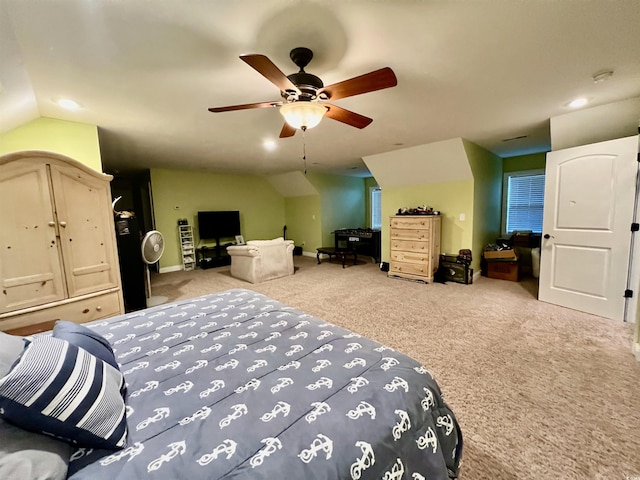 bedroom with light colored carpet, ceiling fan, and lofted ceiling