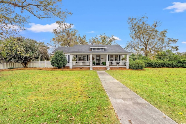 view of front of home with a front yard and covered porch