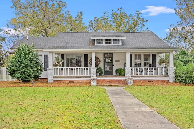 view of front facade with a porch and a front lawn