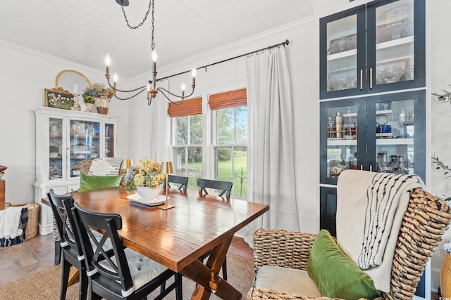 dining space with hardwood / wood-style flooring, wood ceiling, crown molding, and a notable chandelier