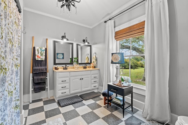 bathroom with ornamental molding, plenty of natural light, and vanity