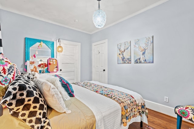 bedroom featuring ornamental molding and wood-type flooring