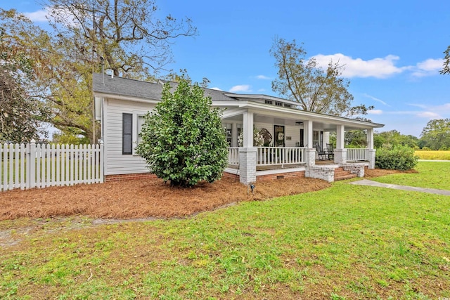 view of front of home featuring a front yard and a porch