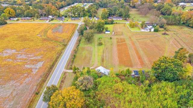 birds eye view of property with a rural view