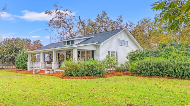 view of front of house featuring a porch and a front lawn