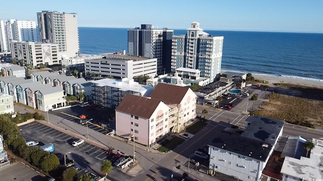 drone / aerial view featuring a view of the beach and a water view