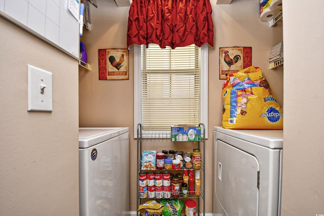 washroom with washing machine and dryer