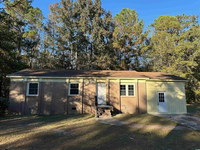 spare room with dark hardwood / wood-style floors and crown molding