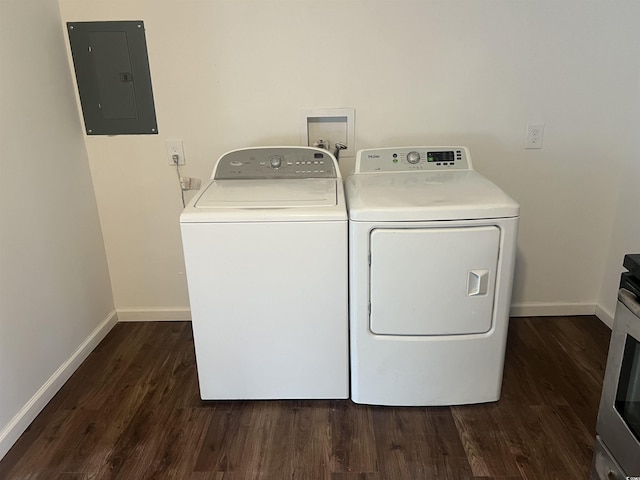 washroom featuring electric panel, independent washer and dryer, and dark hardwood / wood-style floors