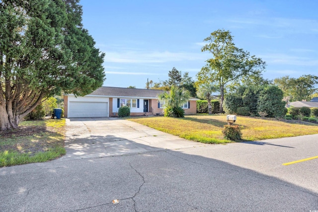 ranch-style home featuring a garage and a front yard