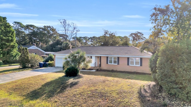 single story home featuring a garage and a front yard