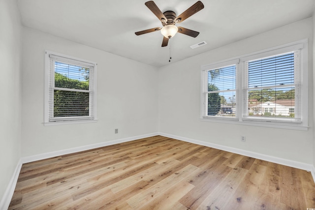 spare room featuring ceiling fan and light hardwood / wood-style flooring