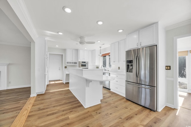 kitchen with white cabinetry, light hardwood / wood-style floors, and stainless steel appliances