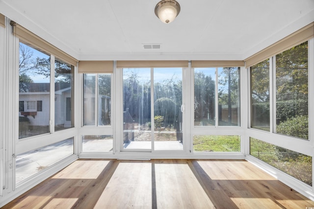 unfurnished sunroom with plenty of natural light