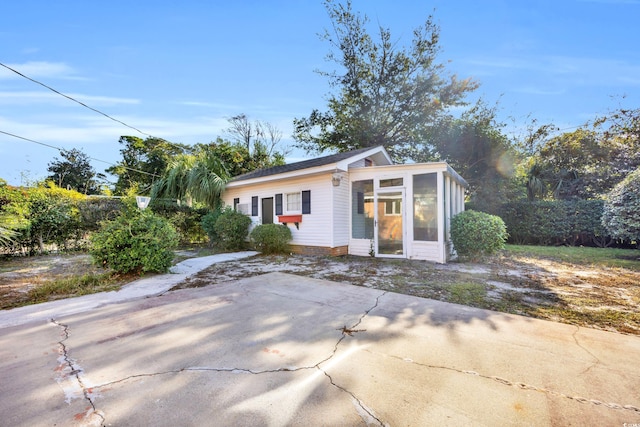 view of front of home featuring a sunroom