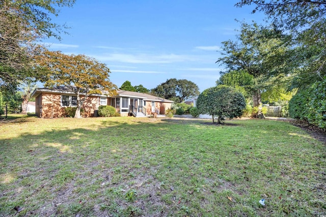 view of yard featuring a sunroom