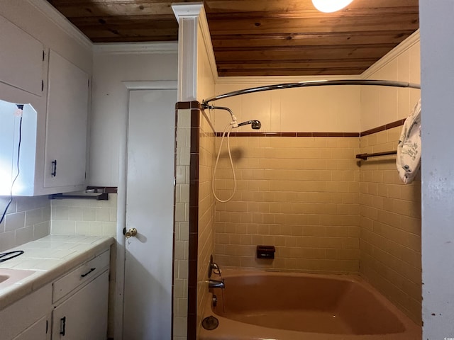 bathroom with decorative backsplash, wooden ceiling, vanity, and  shower combination