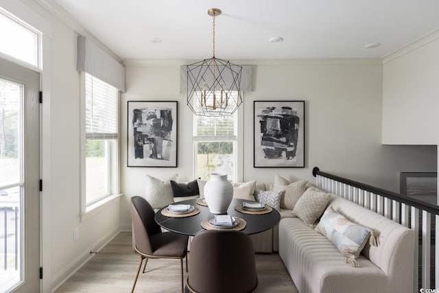 8479 Duke Pl Unit 34, Myrtle Beach, SC 29572 - dining space with a chandelier, plenty of natural light, light wood-style floors, and ornamental molding