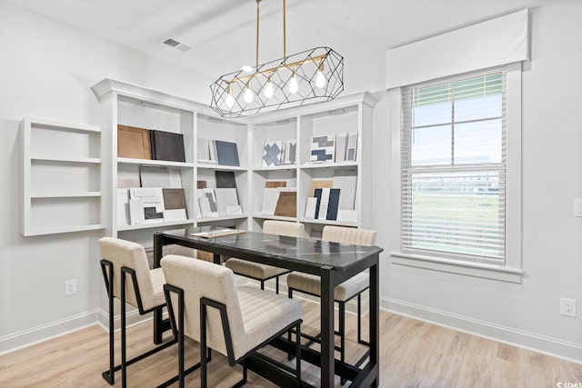 8479 Duke Pl Unit 34, Myrtle Beach, SC 29572 - dining space with a chandelier and light wood-style flooring
