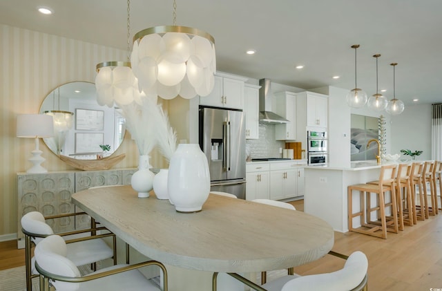 dining room with light hardwood / wood-style floors