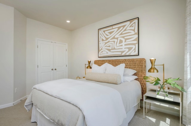 carpeted bedroom with a closet