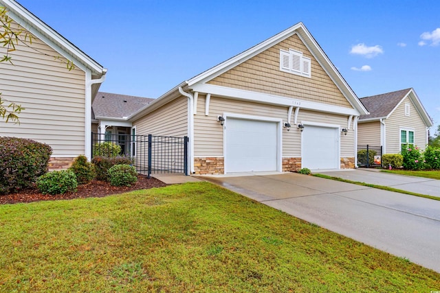 view of front facade with a garage and a front lawn