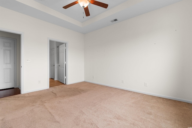 1562 Palmina Loop Unit B, Myrtle Beach, SC 29588 - unfurnished bedroom with carpet, baseboards, a raised ceiling, a ceiling fan, and a walk in closet