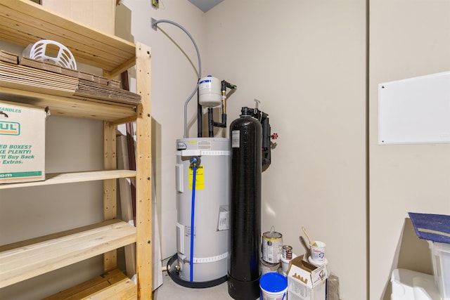 utility room featuring water heater