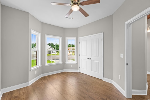 428 Meadow View Ct, Longs, SC 29568 - unfurnished bedroom featuring wood finished floors, baseboards, and a closet