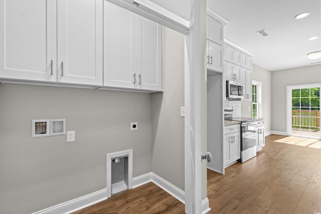 428 Meadow View Ct, Longs, SC 29568 - laundry area with cabinet space, electric dryer hookup, dark wood-type flooring, baseboards, and recessed lighting